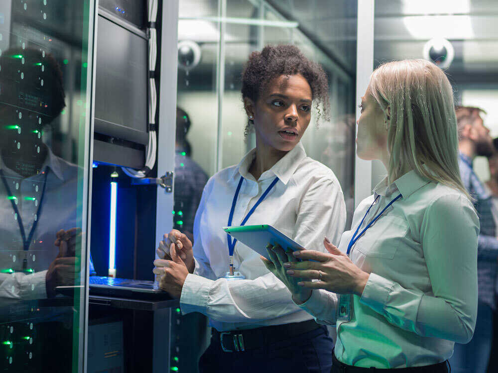 two students in a data center