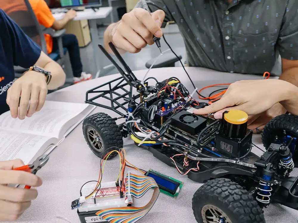 students working or electronic robot