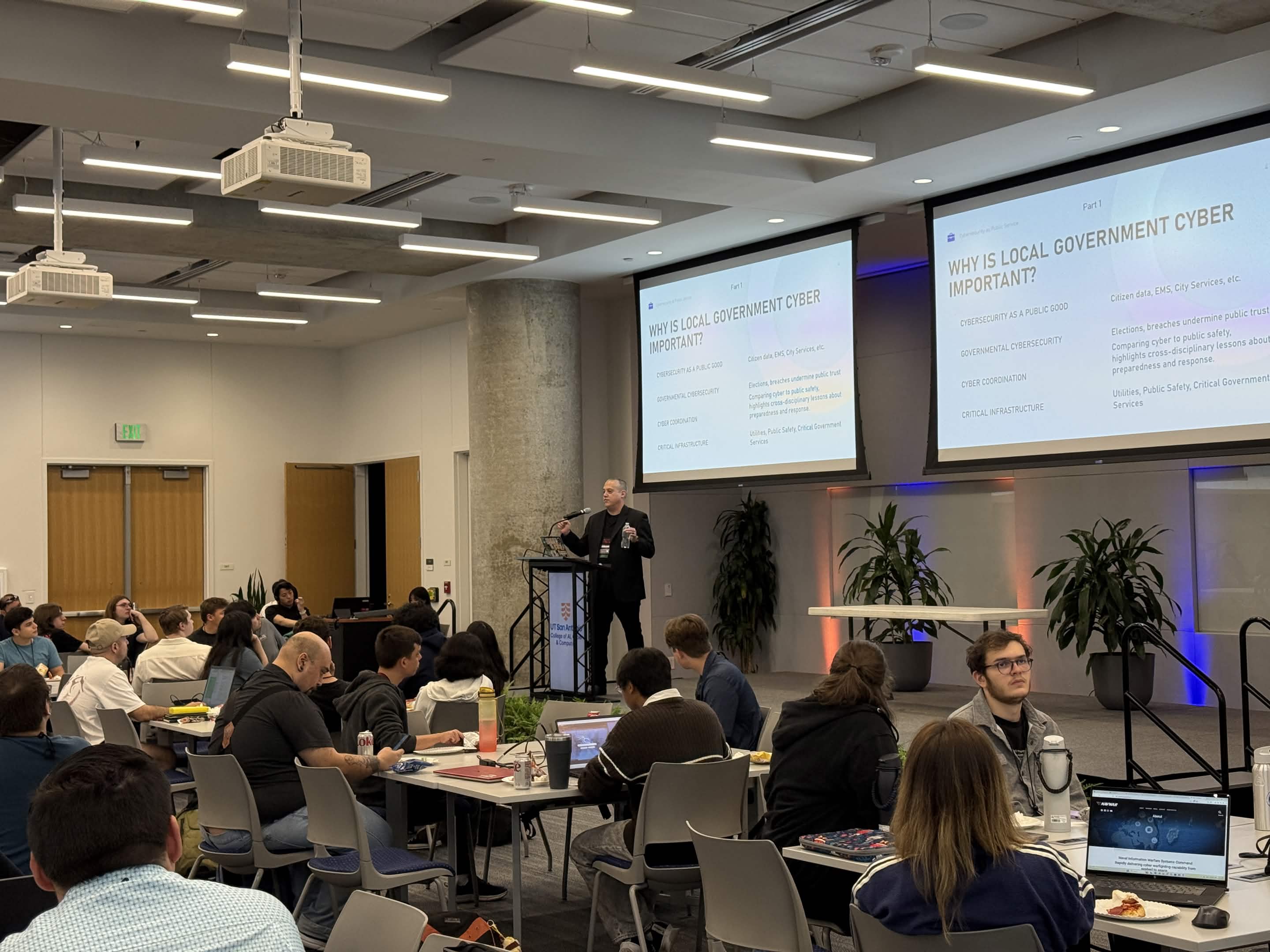 A presenter speaks to students in the Weston Conference Center at Rowdy CyberCon 2025.