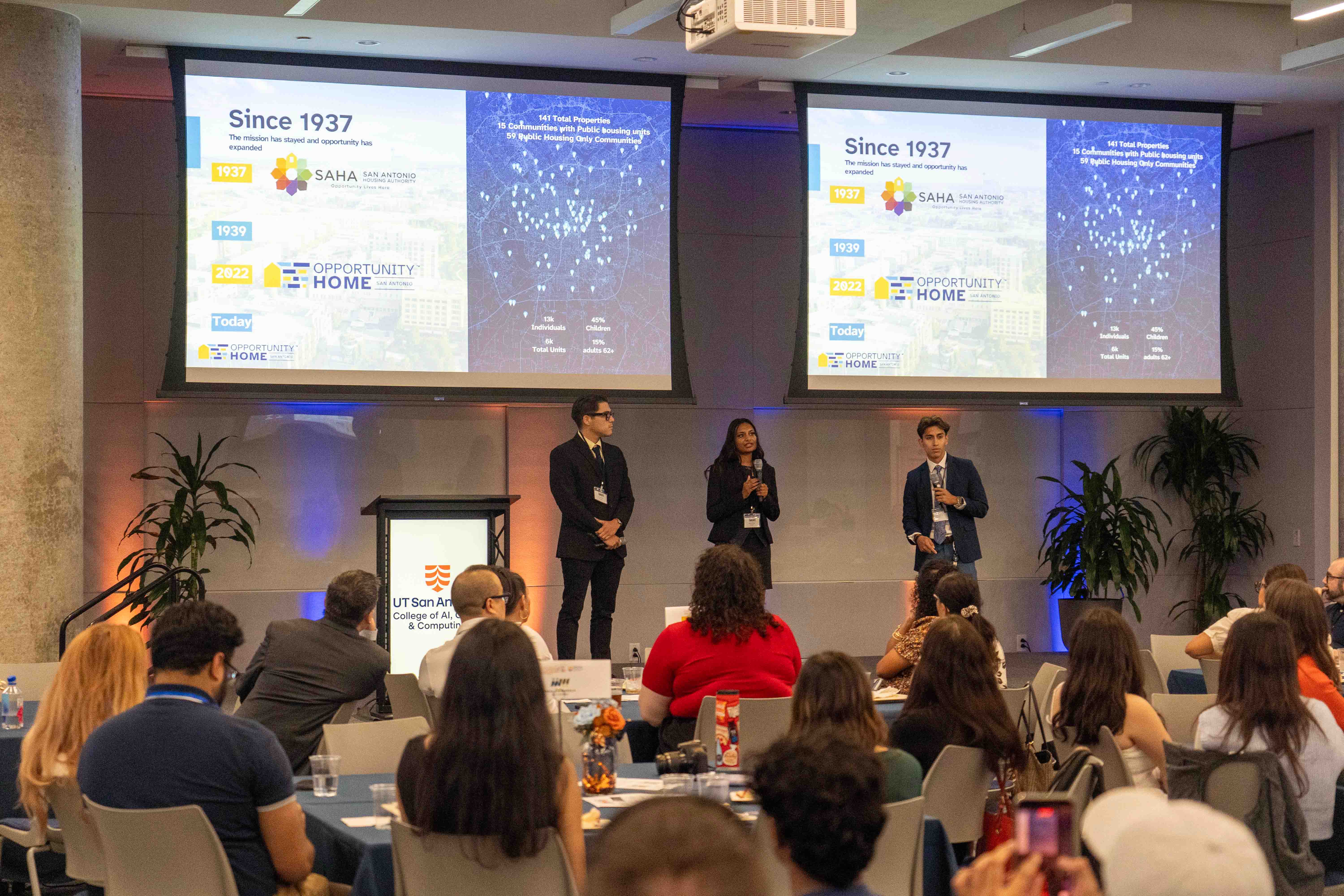 Three students presenting at the Summer Symposium